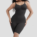 Black shapewear bodysuit worn by a model on a light gray background
