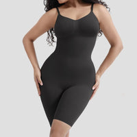 Black shapewear bodysuit worn by a model on a light gray background