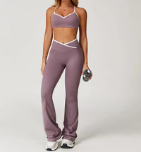Person wearing a mauve sports bra and leggings set on a white background