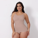 Woman wearing a beige tank top and underwear set on a white background