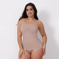 Woman wearing a beige tank top and underwear set on a white background