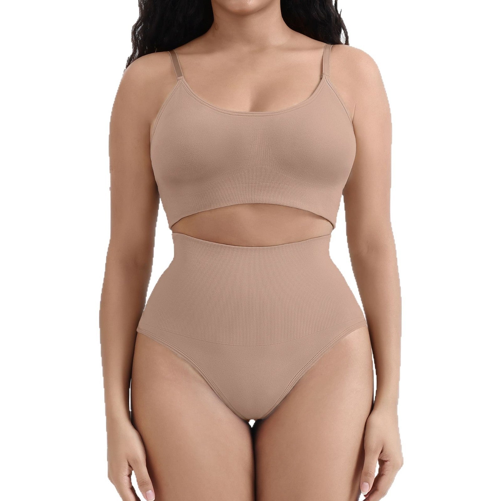 Woman wearing a beige ribbed two-piece set on a white background