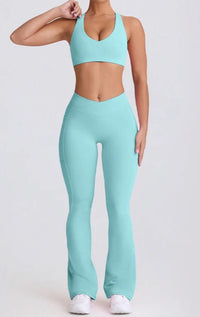 Person wearing a light blue athletic outfit on a white background