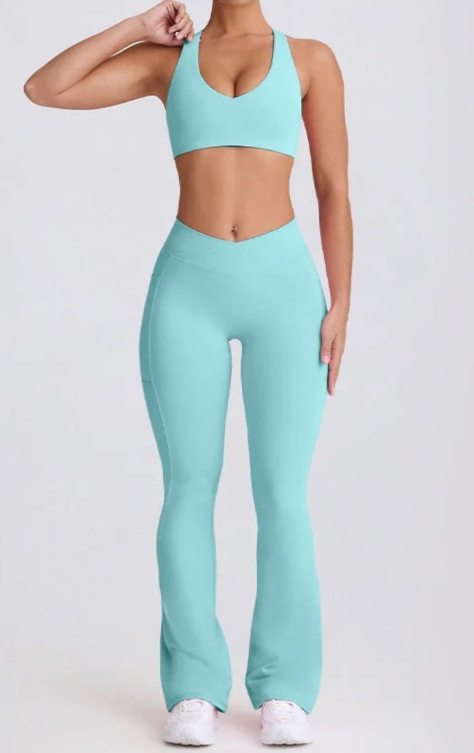 Person wearing a light blue athletic outfit on a white background